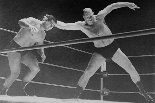 <p>Bettmann Archive</p> (Left to right:) Buddy Marino and Fritz Von Erich wrestling