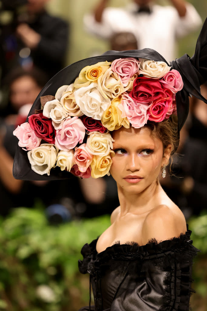 Zendaya with elaborate flower-adorned headpiece