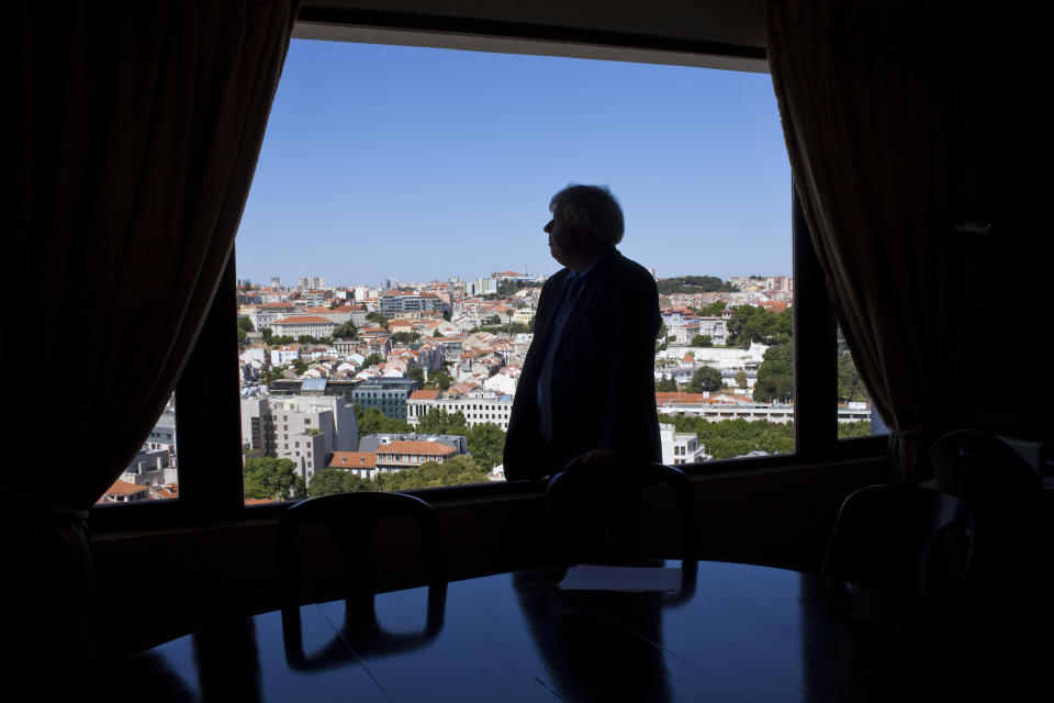 In this July 9, 2012 photo, Luis Menezes Leitao, president of the Lisbon Property Owners' Association looks out of the window of his office at the association's headquarters in Lisbon's upper-class Principe Real neighborhood during an interview. Portugal is scrapping its long-standing rent controls in one of the government's most radical economic and social reforms since the ailing country needed a euro 78 billion bailout last year, when it was engulfed by Europe's financial crisis. Critics say the anticipated rent hikes from next month could price thousands of families out of their homes. At the very least, the change aimed at boosting and modernizing the economy, will add to the financial burden on those struggling to cope with pay cuts and tax hikes designed to ease the country's crippling debt load. (AP Photo/Armando Franca)