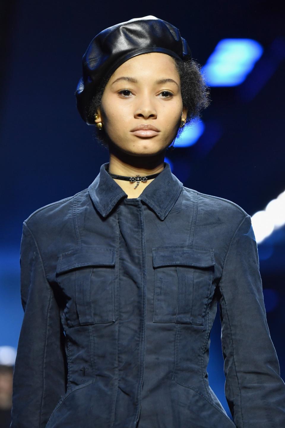 Model Lineisy Montero wears the new black leather beret at the Christian Dior Fall/Winter 2017 show.