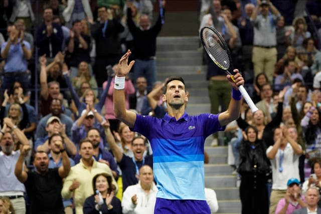 Novak Djokovic celebrates winning the third set