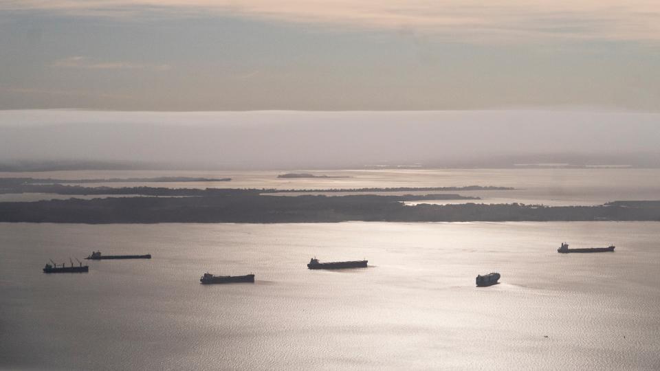 Container ships wait in the Chesapeake Bay near the scene where a container ship crashed into the Francis Scott Key Bridge in Baltimore. (Carolyn Van Houten/The Washington Post)