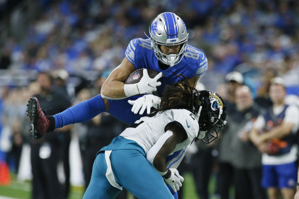 Jacksonville Jaguars safety Rayshawn Jenkins (2) pushes Detroit Lions tight end Shane Zylstra (84) out of bounds during the second half of an NFL football game, Sunday, Dec. 4, 2022, in Detroit. (AP Photo/Duane Burleson)