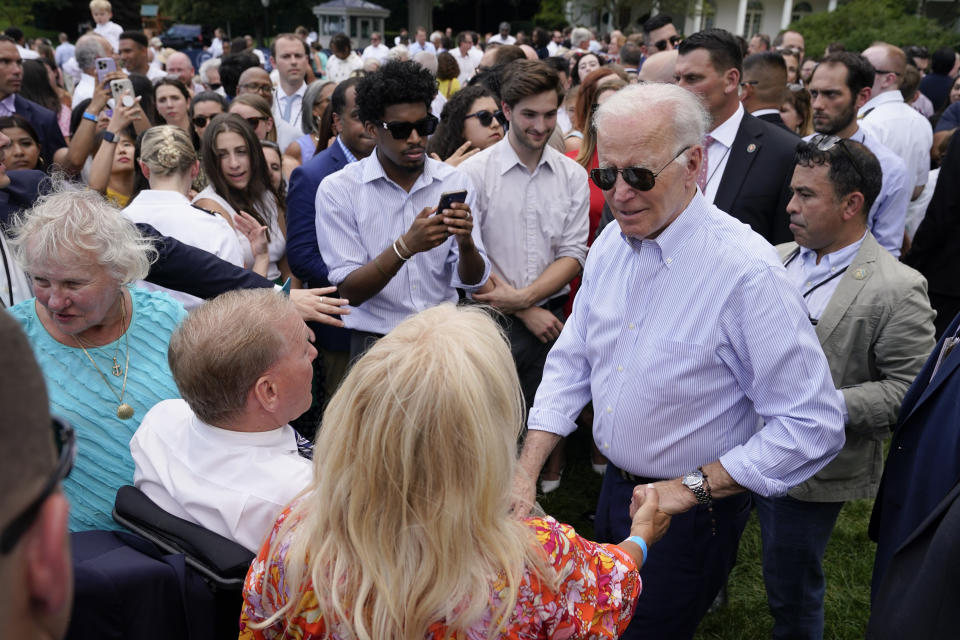 President Joe Biden greets people during the Congressional Picnic on the South Lawn of the White House, Tuesday, July 12, 2022, in Washington. (AP Photo/Patrick Semansky)