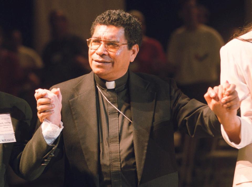 FILE - Bishop Carlos Ximenes Belo of East Timor, sings along with participants at the National Catholic Gathering for Jubilee Justice held on the UCLA Campus in Los Angeles, on July 17, 1999. Belo has been accused in a Dutch magazine article of sexually abusing boys in East Timor in the 1990s, rocking the Catholic Church in the impoverished nation and forcing officials at the Vatican and his religious order to scramble to provide answers. (AP Photo/Neil Jacobs, File)