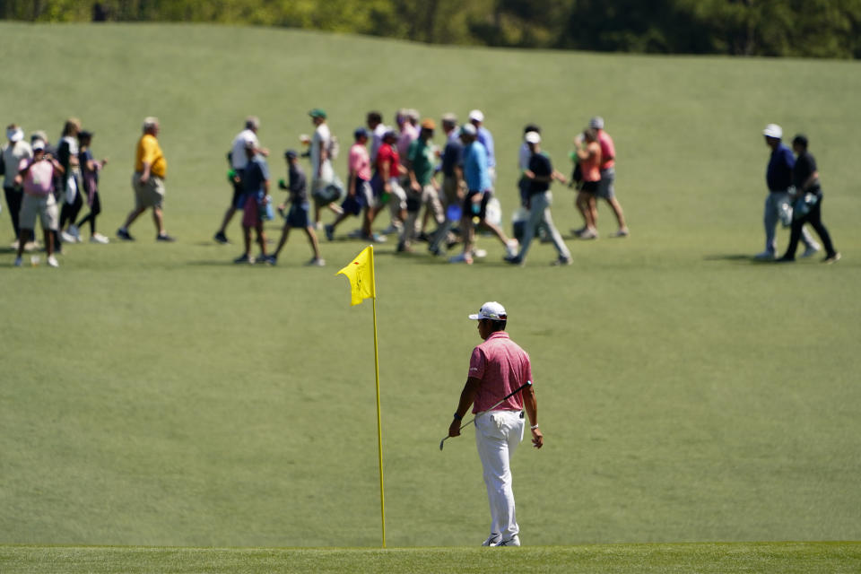 Hideki Matsuyama, of Japan, waits to play on the 15th green during a practice round for the Masters golf tournament on Monday, April 4, 2022, in Augusta, Ga. (AP Photo/Matt Slocum)