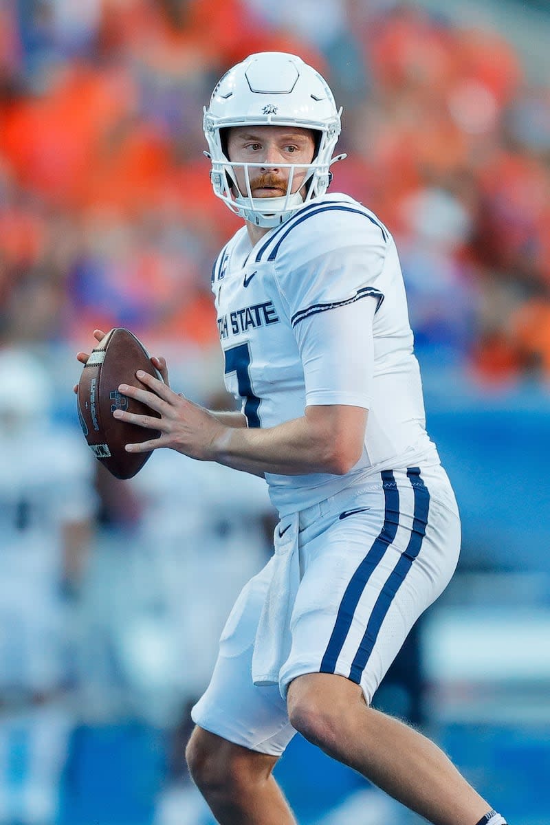 Utah State quarterback Spencer Petras (7) looks down field against Boise State in the first half of an NCAA college football game, Saturday, Oct. 5, 2024, in Boise, Idaho. . (AP Photo/Steve Conner) | Steve Conner