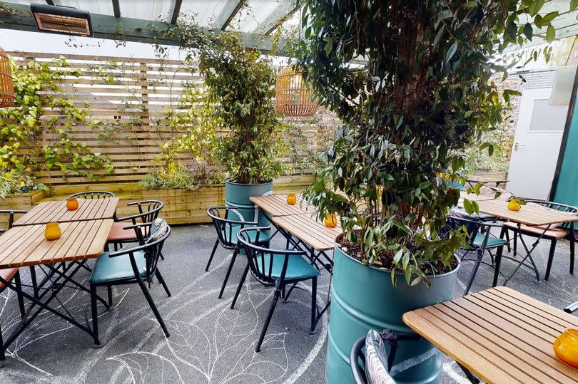 The bar and kitchen has a 'hidden' garden area that is popular in the summer