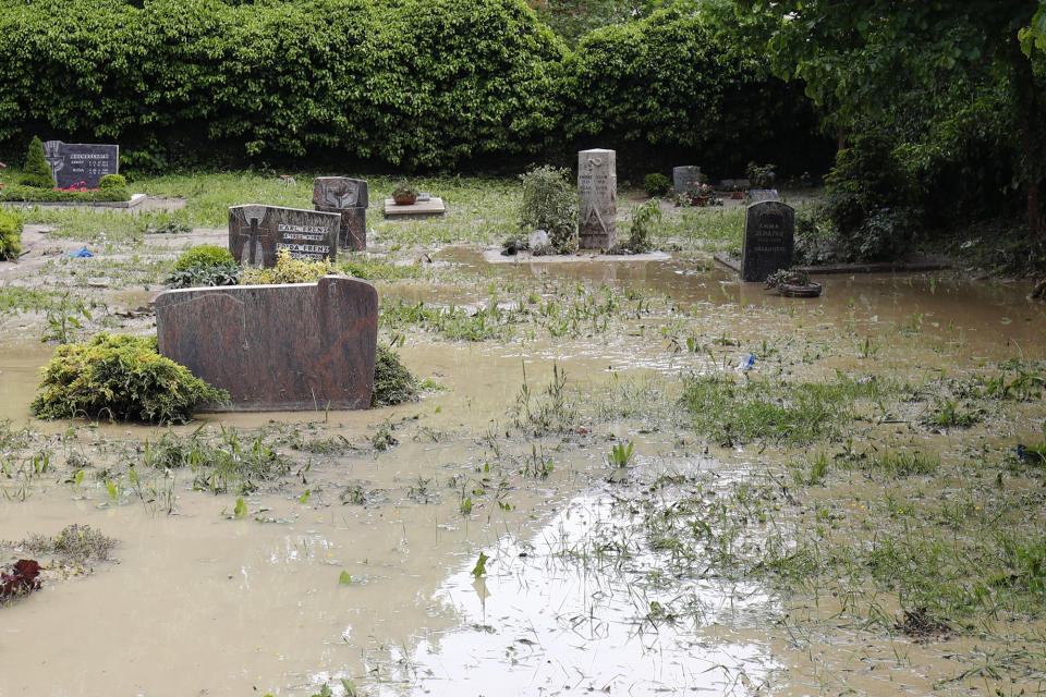 <p>A graveyard is flooded in Braunsbach, Germany, on May 30, 2016. (Kai Pfaffenbach/Reuters) </p>