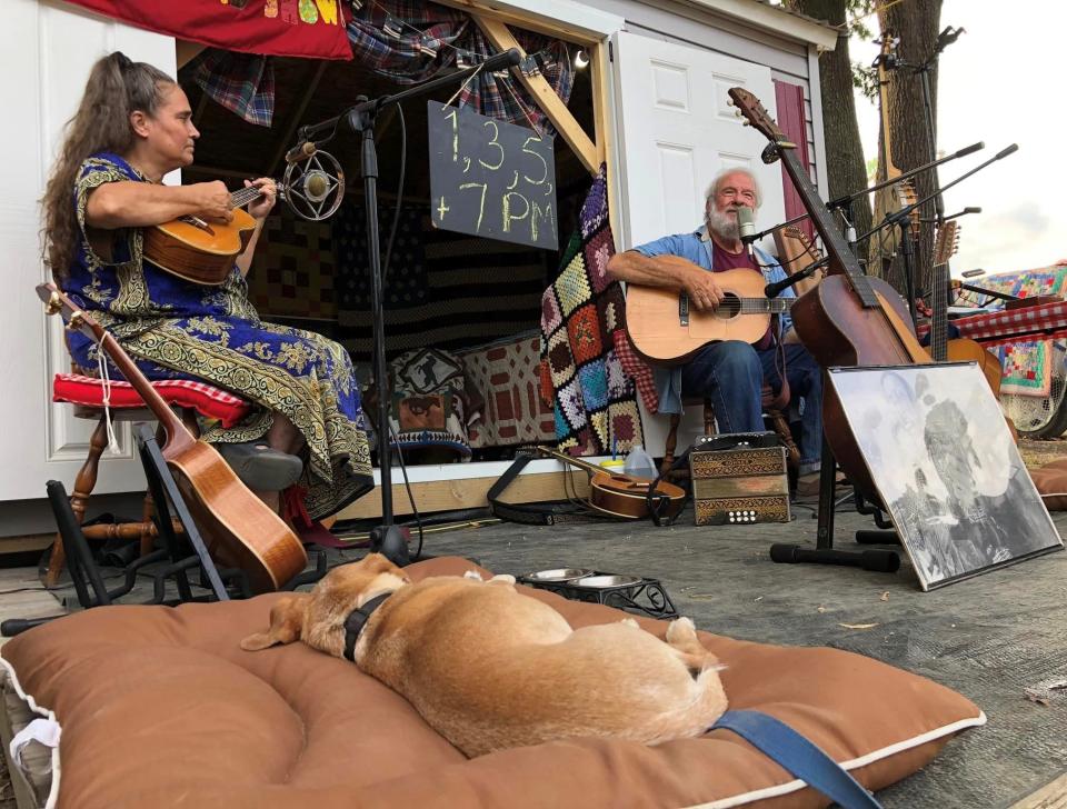 Jeanne and Bob Zentz perform Americana music at the 2022 Chesterfield County Fair while Teddy sleeps.