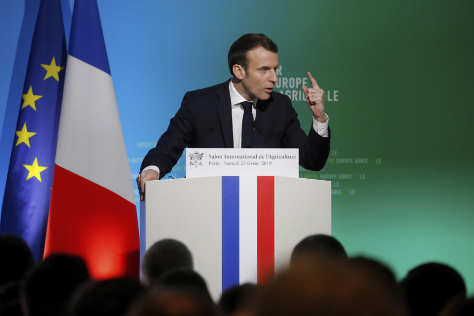 French President Emmanuel Macron delivers a speech at the opening of the International Agriculture Fair in Paris, France, Saturday, Feb. 23, 2019. Macron is visiting France's biggest premier agricultural fair amid nationwide anger at government policies seen as favoring urban elites and neglecting the heartland. (Charles Platiau/Pool Photo via AP)