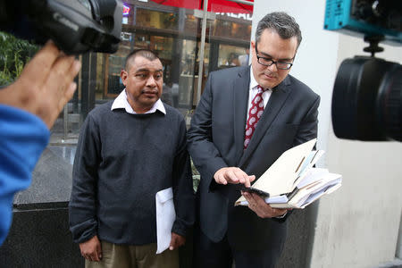 Mario Vargas-Lopez, 45, (L) is interviewed outside immigration court with his lawyer Alex Galvez in Los Angeles, California, U.S., March 22, 2017. REUTERS/Lucy Nicholson