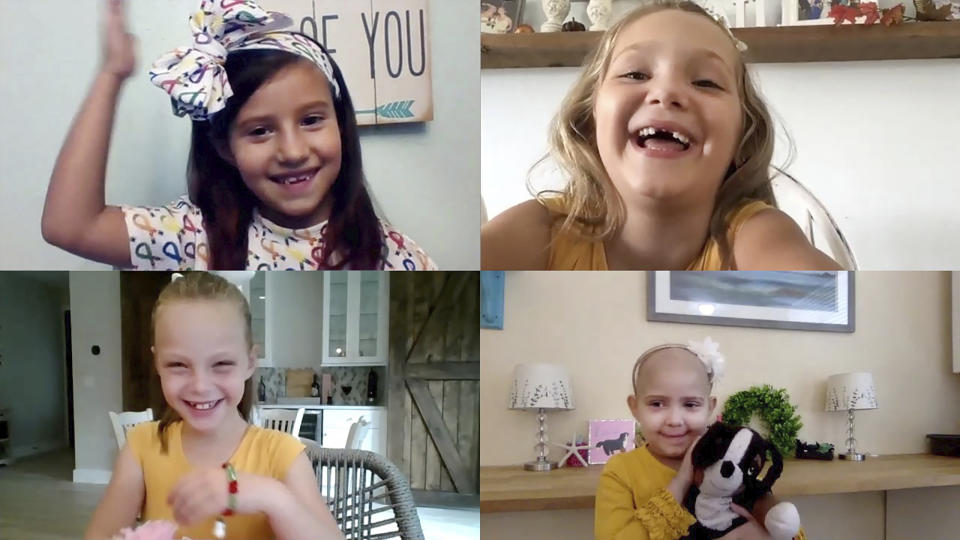 In this video screen grab provided by Johns Hopkins All Children’s Hospital, cancer survivors Chloe Grimes, Avalynn Luciano, Lauren Glynn and McKinley Moore, clockwise from top left, talk during a virtual reunion from their homes in Florida, on Sept. 17, 2020. After the coronavirus pandemic hit, their mothers realized an in-person reunion this year was out of the question and organized a virtual meetup. (Courtesy of Johns Hopkins All Children’s Hospital via AP)