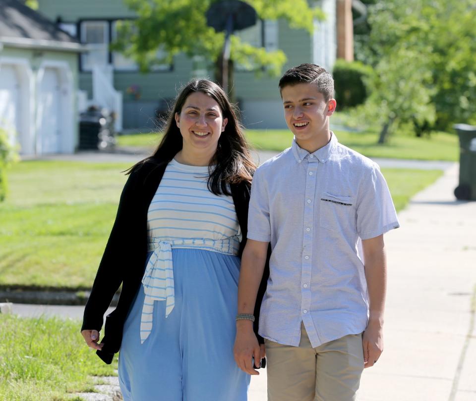 Chale Ashley and her newly adopted son Ashton Ashley walk outside their Farmingdale home Wednesday, May 26, 2022.  She  was interviewed about the challenges of kinship adoption of Ashton who used to be her nephew.