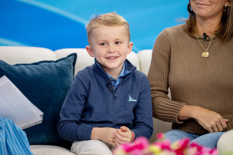 Oscar smiles on the set of TODAY as his parents share their harrowing story with Hoda and Savannah. (Nathan Congleton / TODAY)