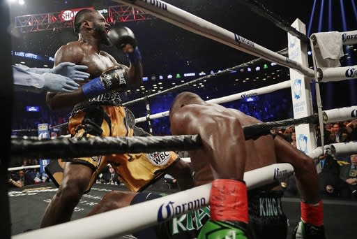 Deontay Wilder celebrates after knocking down Luis Ortiz during the sixth round of a WBC heavyweight championship bout Saturday, March 3, 2018, in New York. Wilder stopped Ortiz in the 10th round. (AP)