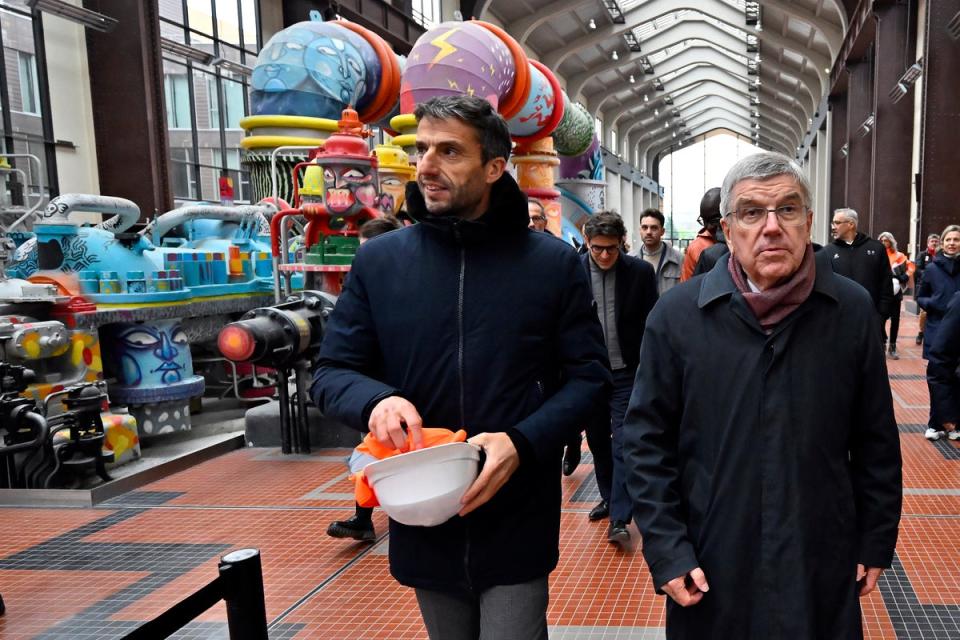 IOC president Thomas Bach, right, and Paris 2024 president Tony Estanguet visit the Olympic Village in December (Getty)