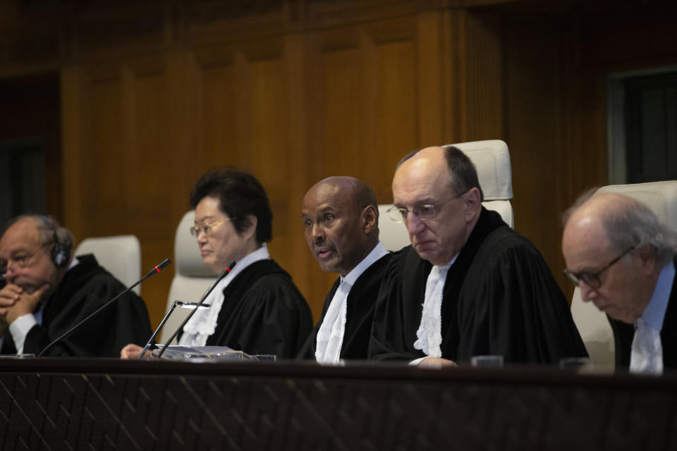 Presiding judge Abdulqawi Ahmed Yusuf of Somalia, center, and other judges open the first day of three days of hearings in the case brought by Gambia against Myanmar Myanmar's at the International Court of Justice for the first day of three days of hearings in The Hague, Netherlands, Tuesday, Dec. 10, 2019. Myanmar's leader Aung San Suu Kyi will represent Myanmar in a case filed by Gambia at the ICJ, the United Nations' highest court, accusing Myanmar of genocide in its campaign against the Rohingya Muslim minority. (AP Photo/Peter Dejong)