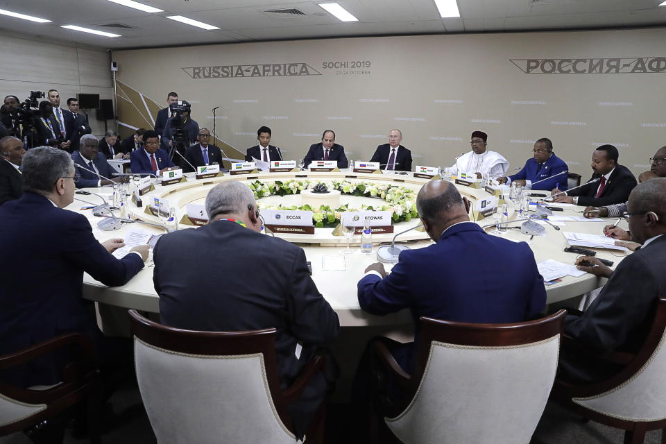 Russian President Vladimir Putin, center back, Egyptian President Abdel-Fattah El-Sissi, center left, and Nigerien President Mahamadou Issoufou, right of Putin, attend a luncheon with the heads of African regional organizations on the sideline of Russia-Africa summit in the Black Sea resort of Sochi, Russia, Wednesday, Oct. 23, 2019. (Mikhail Metzel, TASS News Agency Pool Photo via AP)