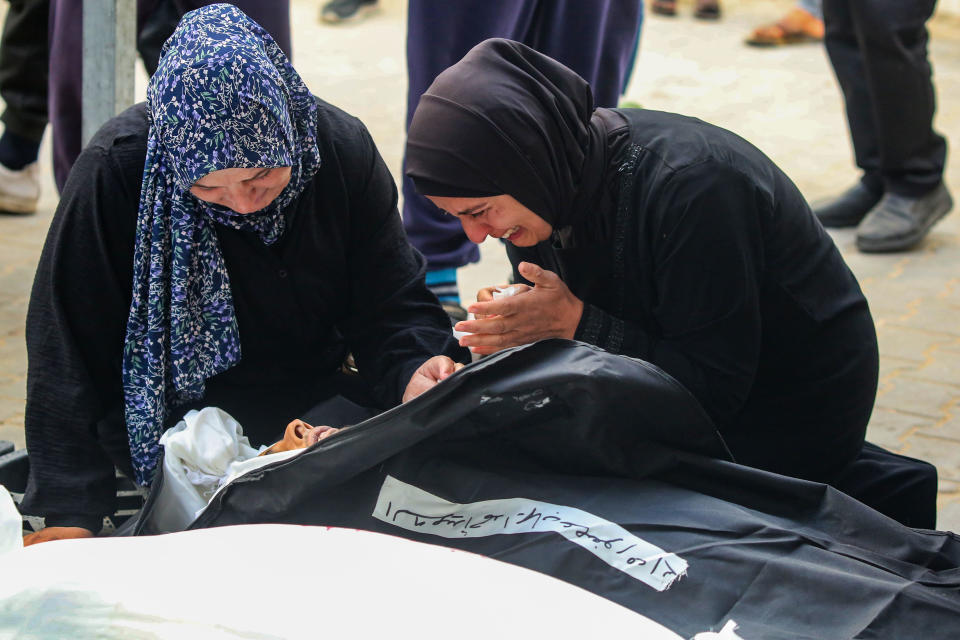 Women mourn over the body of a victim of an Israeli strike, March 26, 2024, in Rafah, southern Gaza. / Credit: Ahmad Hasaballah/Getty