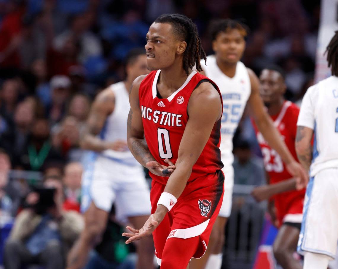 N.C. State’s DJ Horne (0) celebrates making a three-pointer during the first half of N.C. State’s game against UNC in the championship game of the 2024 ACC Men’s Basketball Tournament at Capital One Arena in Washington, D.C., Saturday, March 16, 2024.