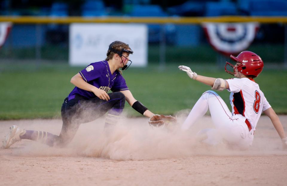 Laingsburg's Alaina Asher, right, is safe at second against Fowlerville's Molly Lamar during their opening day game of the Greater Lansing Area Sports Hall of Fame Softball Classic, Monday, May 22, 2023, at Ranney Park.