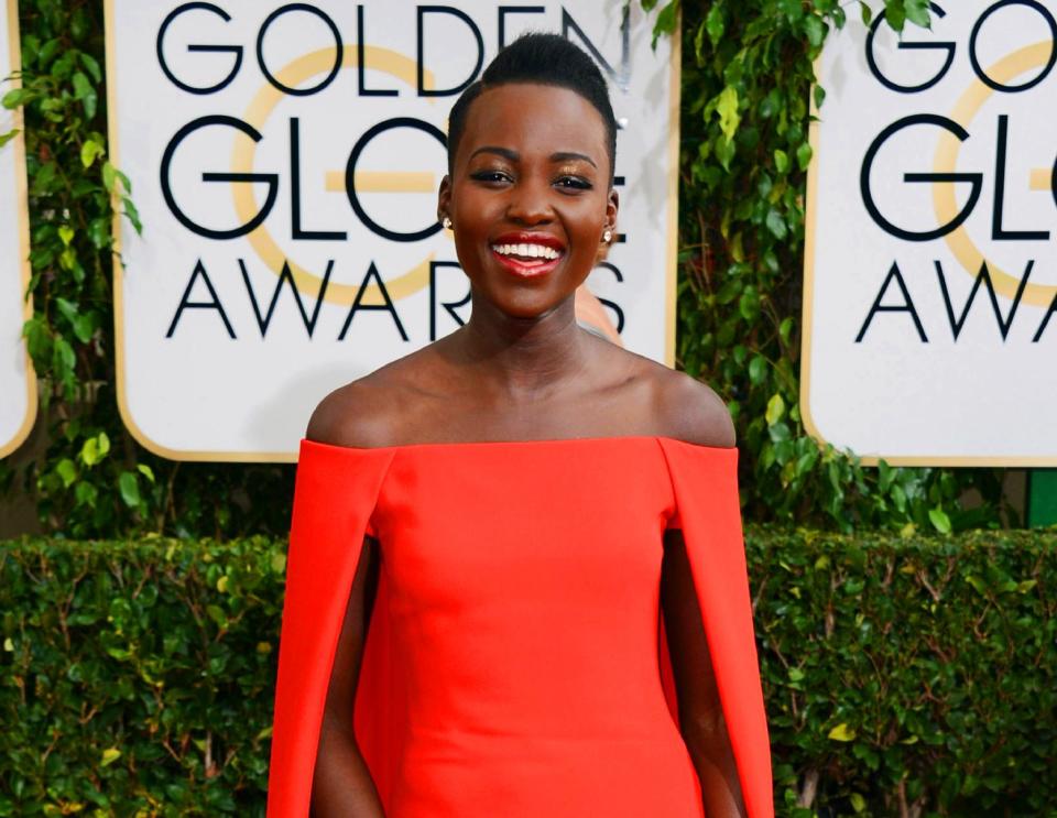 FILE - In this Jan. 12, 2014 file photo, Lupita Nyong'o arrives at the 71st annual Golden Globe Awards at the Beverly Hilton Hotel, in Beverly Hills, Calif. The Mexican-born Kenyan will be the first black ambassador for Lancome, which features Julia Roberts, Kate Winslet, Penelope Cruz and Lily Collins as spokeswomen. (Photo by Jordan Strauss/Invision/AP, File)