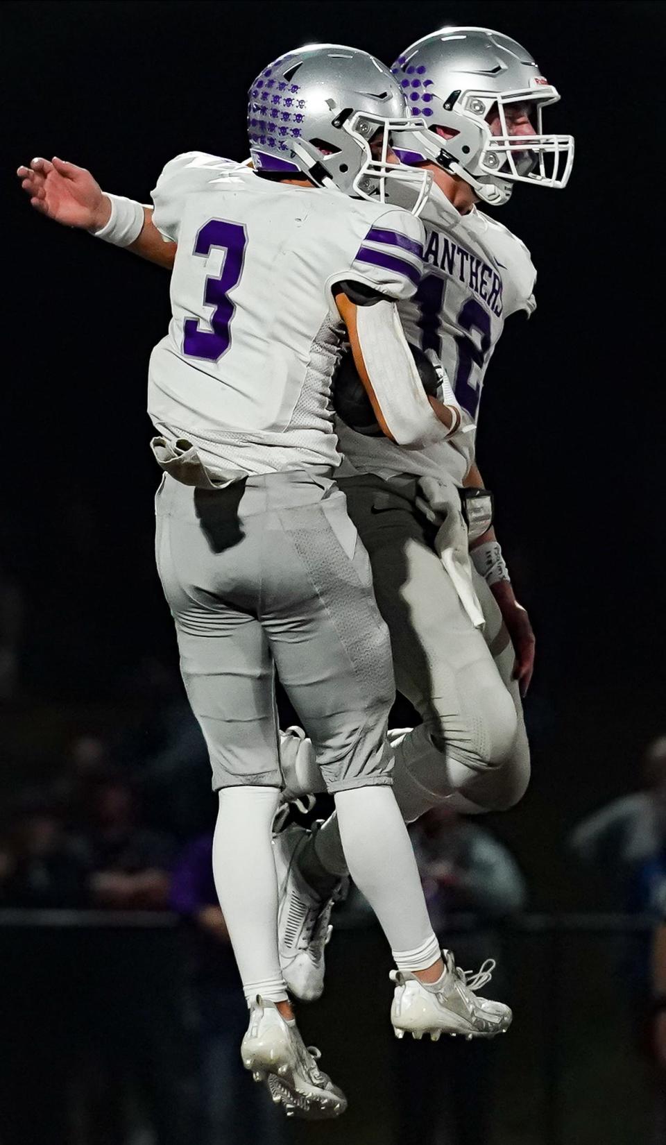 Bloomington South’s Jarrin Alley (12) celebrates with Lucas Waldon (3) after a touchdown by Waldon during the IHSAA sectional semi-final football game at Bloomington North on Friday, Oct. 27, 2023.