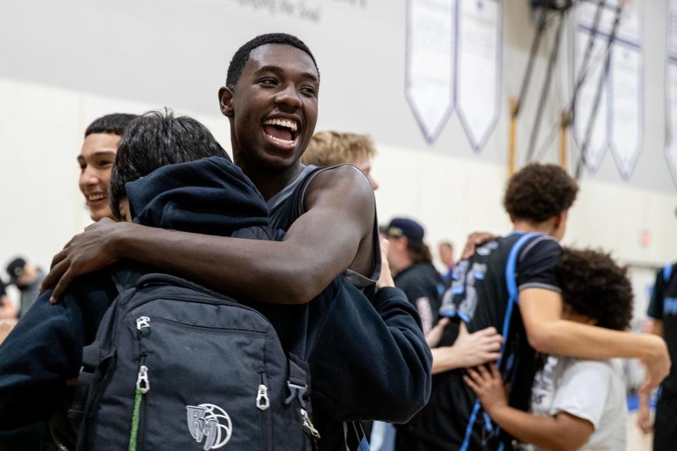 Rancho Mirage senior Jonathan Covington (23) hugs a friend after defeating Desert Christian Academy in a first-round CIF Division 4A basketball playoff game in Bermuda Dunes, Calif., on Wednesday, February 7, 2024.