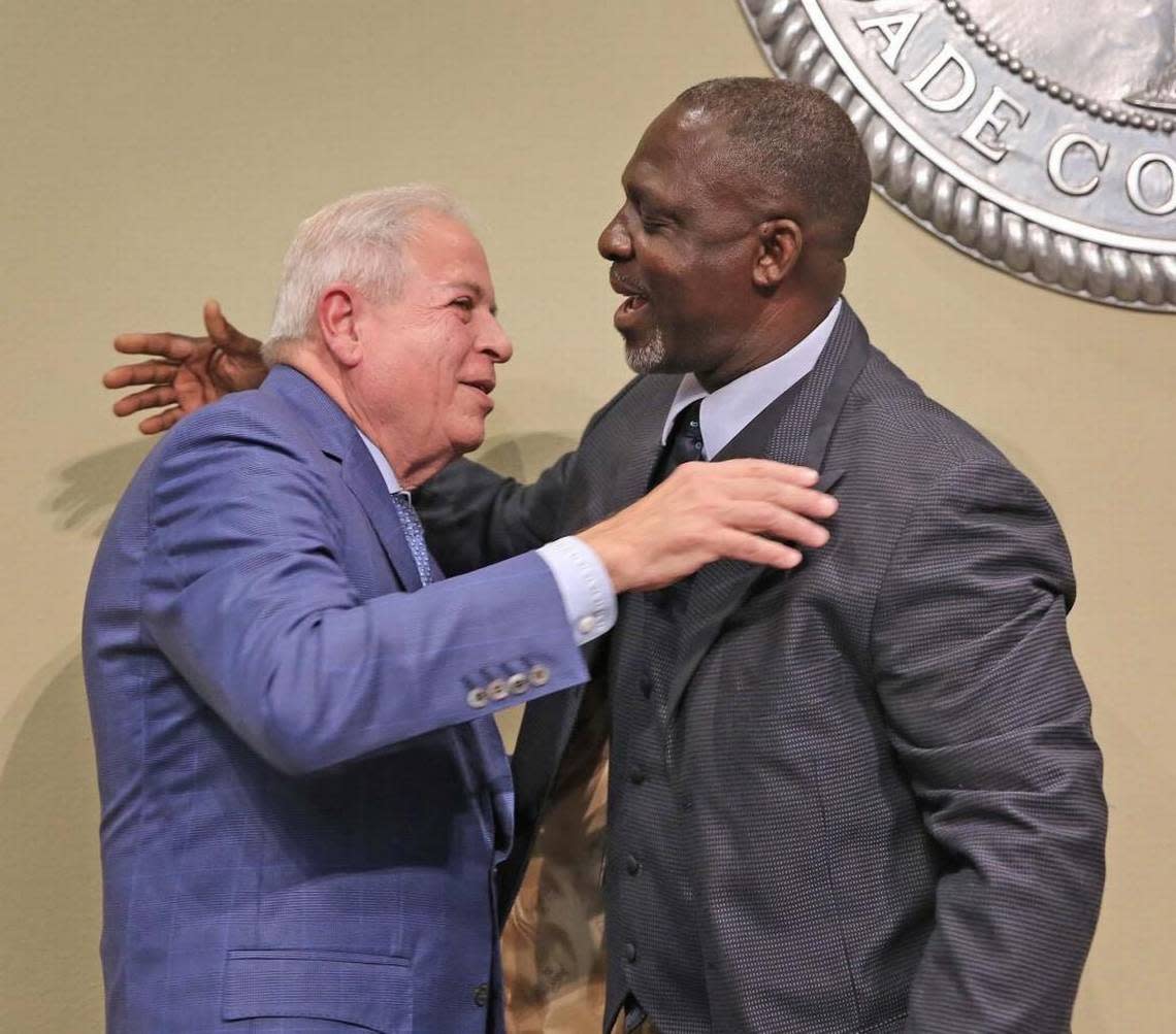 Miami Mayor Tomas Regalado, left, is greeted by retired Sergeant-at-Arms Raymond Carvil, his longtime police escort, after Regalado made his last State of the City address in 2017.