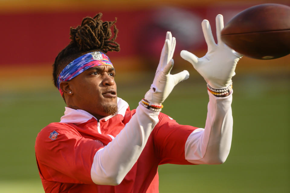 Kansas City Chiefs wide receiver Demarcus Robinson (11) wears a Crucial Catch headband during warmups before an NFL football game against the New England Patriots, Monday, Oct. 5, 2020, in Kansas City, Mo. (AP Photo/Reed Hoffmann)