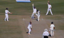 Cricket - India v England - Third Test cricket match - Punjab Cricket Association Stadium, Mohali, India - 27/11/16. England's Adil Rashid (C-foreground) successfully appeals for the dismissal of India's Parthiv Patel. REUTERS/Adnan Abidi