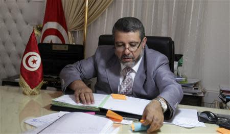 Religious Affairs Minister Noureddine Khadmi works in his office in Tunis September 2, 2013. REUTERS/Zoubeir Souissi