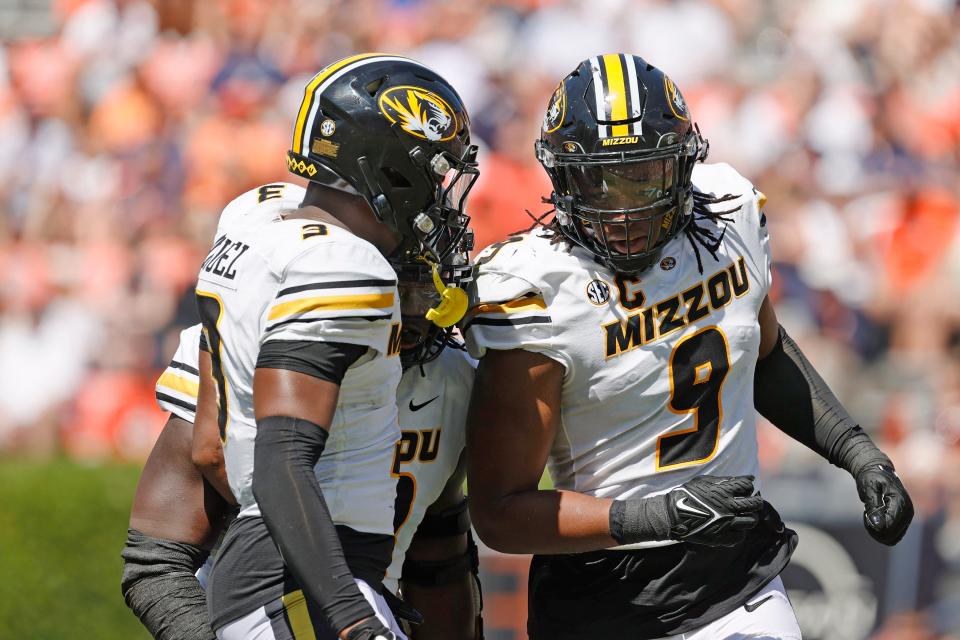 Missouri defensive lineman Isaiah McGuire (9) celebrates with defensive back Martez Manuel (3) after sacking Auburn quarterback Robby Ashford (9) earlier this season at Jordan-Hare Stadium in Auburn, Ala.