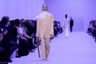 A model wears a creation for the Jil Sander Spring Summer 2022 collection during Milan Fashion Week, in Milan, Italy, Wednesday, Sept. 22, 2021. (AP Photo/Luca Bruno)