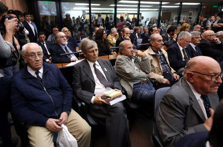 Former Argentine navy officers Jorge Acosta (L) and Alfredo Astiz (2nd R) and other members of Argentina's Naval Mechanics School, known as the ESMA, where the military regime held and tortured thousands of leftists from 1976 to 1983, attend the sentence hearing of the five-year trial for their role during the 1976-1983 dictatorship in Buenos Aires, November 29, 2017. REUTERS/Marcos Brindicci