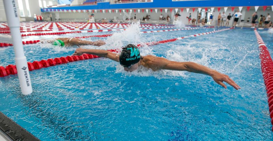 West Port's Caleb Rohacs finishes the 100-yard fly during the MCIAC swimming championships in Ocala, on Sept. 24, 2022.