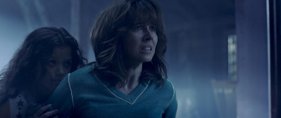 This image released by Warner Bros. Pictures shows Jaynee-Lynne Kinchen, left, and Linda Cardellini in a scene from "The Curse of La Llorona." (Warner Bros. Pictures via AP)