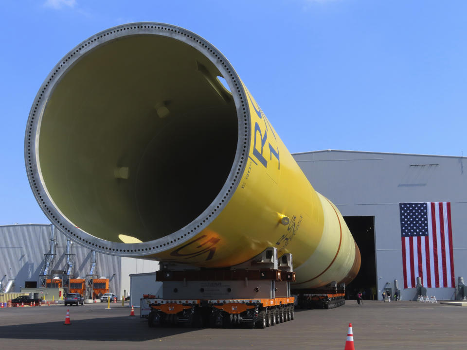 A giant monopile, the foundation for an offshore wind turbine, sits on rollers at the Paulsboro Marine Terminal in Paulsboro, N.J. on Thursday, July 6, 2023, when New Jersey Gov. Phil Murphy planned to sign a bill granting a tax break to offshore wind developer Orsted. (AP Photo/Wayne Parry)