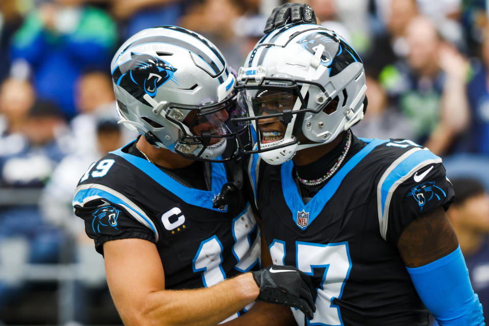 Sep 24, 2023; Seattle, Washington, USA; Carolina Panthers wide receiver DJ Chark Jr. (17) celebrates with wide receiver Adam Thielen (19) after catching a touchdown pass against the Seattle Seahawks during the second quarter at Lumen Field. Mandatory Credit: Joe Nicholson-USA TODAY Sports