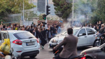 <p>People clash in the streets of Tehran on Sept. 19. </p>