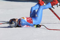 Italy's Sofia Goggia celebrates at the finish line during an alpine ski, women's World Cup downhill, in Cortina d'Ampezzo, Italy, Saturday, Jan. 22, 2022. (AP Photo/Alessandro Trovati)