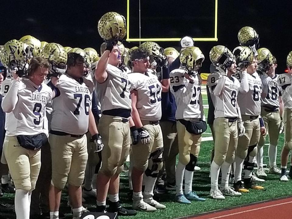 The Bald Eagle Area football team stands near the band while it plays the alma mater after falling to Southern Columbia 18-8 in the PIAA Class 2A quarterfinals at Southern Columbia.