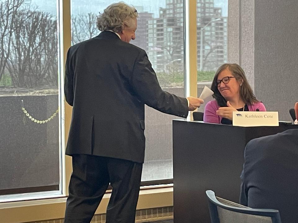 Attorney Andrew Feinstein hands Kathleen Cote, former Killingly Public Schools director of Mental Health, Student Wellness and Family Engagement, a document to look at during the impartial hearing Tuesday.