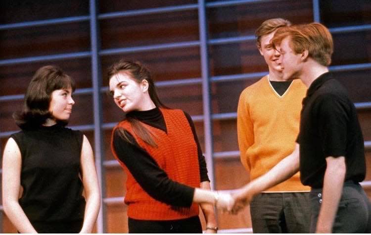 Edmund Gaynes (on the right) holding hands with Liza Minnelli during rehearsal for the 1963 Off-Broadway revival of “Best Foot Forward.” Also pictured: Kay Cole (on the left) and Christopher Walken (right)