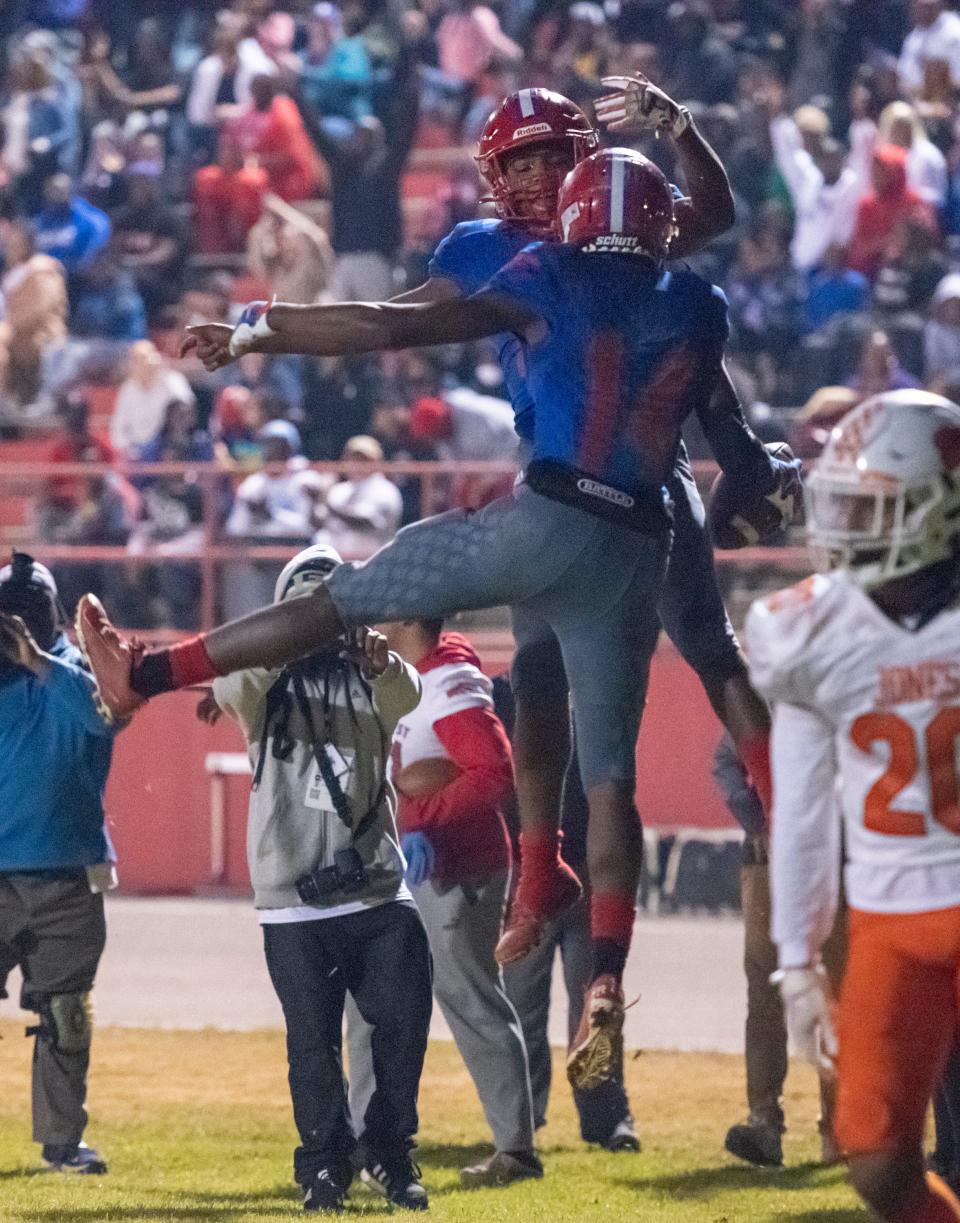 Donielle Hayes (14) celebrates his touchdown giving the Eagles a 6-0 lead during the Jones vs Pine Forest playoff football game at Pine Forest High School in Pensacola on Friday, Dec. 3, 2021.  The Eagles defeated the Tigers 20-13 in overtime sending them to the state championship game.