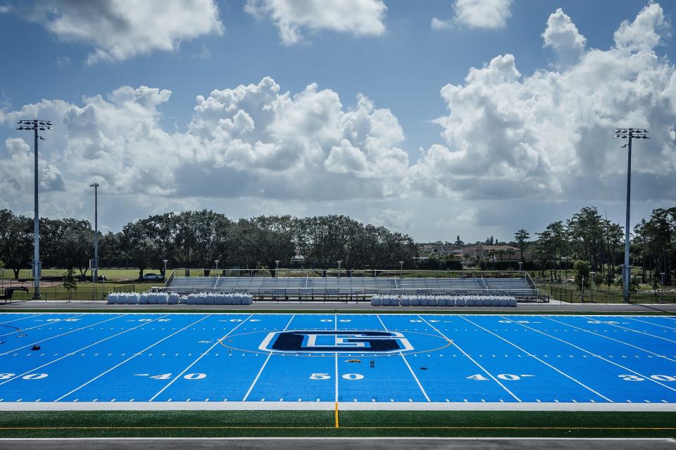 The artificial turf is blue at Dr. Joaquin Garcia High School in unincorporated Palm Beach County,