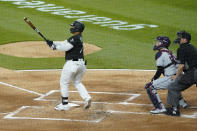 Chicago White Sox's Yermin Mercedes (73) hits a three-run home run against the Cleveland Indians during the first inning of a baseball game, Wednesday, April, 14, 2021, in Chicago. (AP Photo/David Banks)