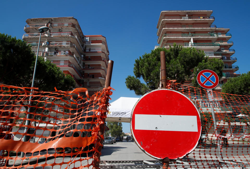 A residential complex where 49 people tested positive for the coronavirus disease is cordoned off after it was placed under quarantine in the village of Mondragone, northwest of Naples, Italy, June 26, 2020. / Credit: CIRO DE LUCA/REUTERS