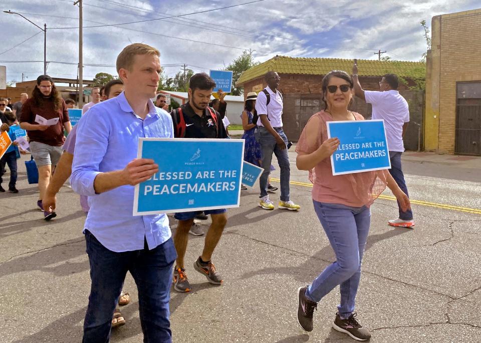The Rev. John-Mark Hart, senior pastor of Christ Community Church, walks alongside Gloria Torres, executive director of Calle Dos Cinco-Capitol Hill, at Stronger Together OKC's Peace Walk on May 1 in south Oklahoma City.